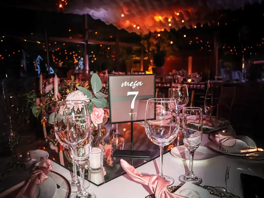 An evening event table with string lights and a table number